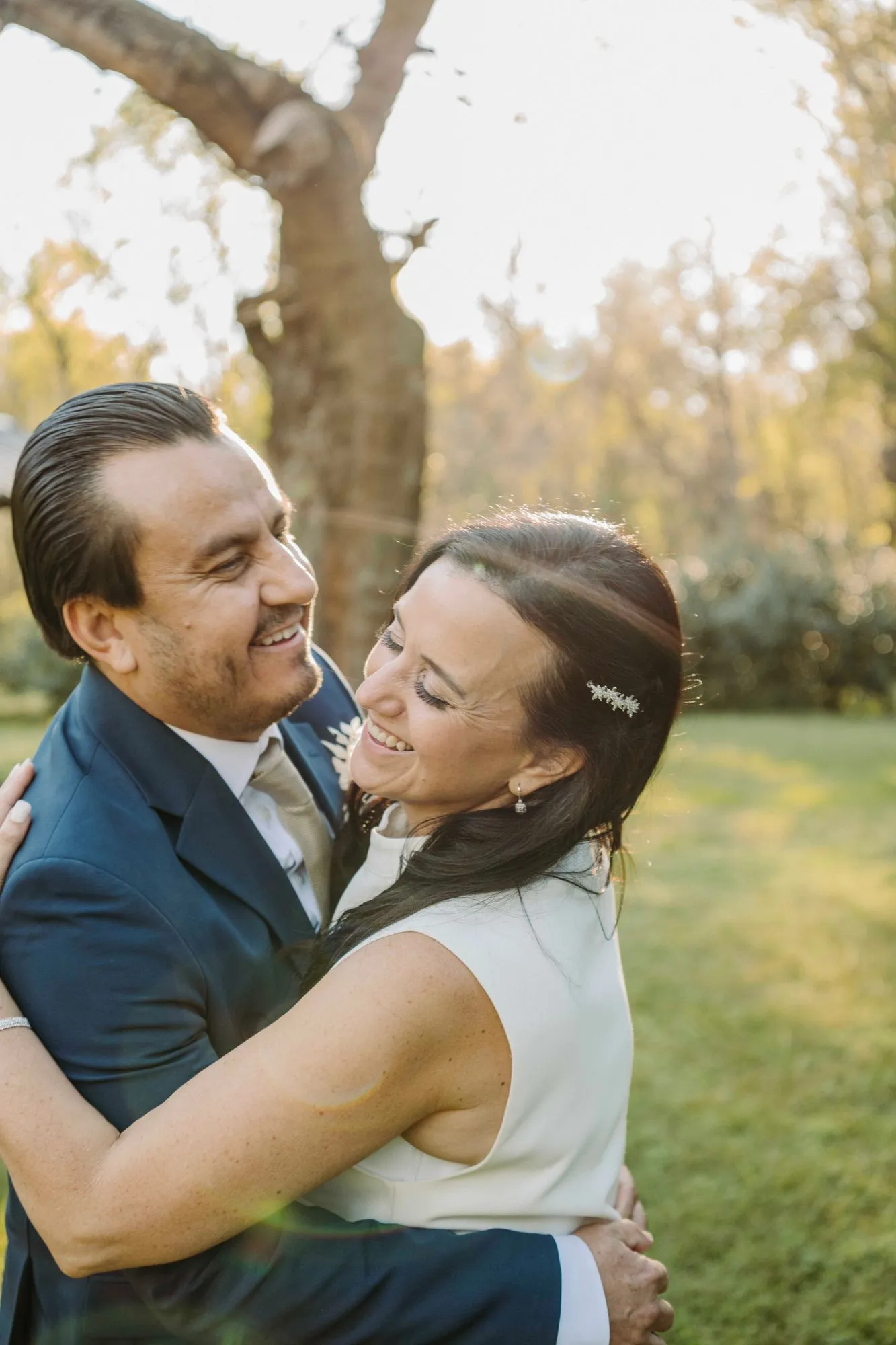 Couple embracing at golden hour at The Heritage Barn in Conover, NC